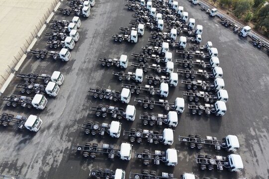 New truck chassis cabs parked in rows