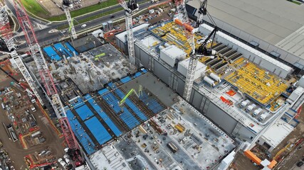 Obraz premium Large data centre industrial facility building constructing process aerial view