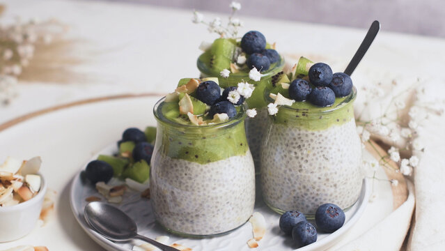Chia pudding jars layered with kiwi and fresh blueberries