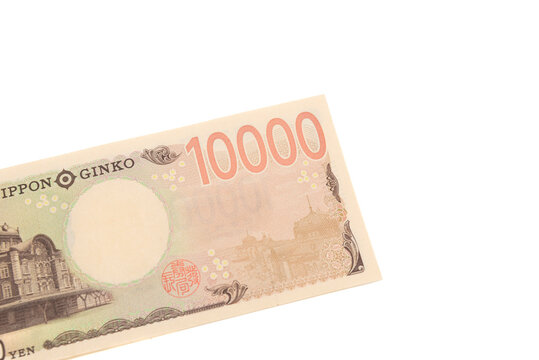 Top view of the reverse side of a 10,000 Japanese yen banknote (Series E). Features the Phoenix statue of Byodo-in Temple. Currency isolated on white background.