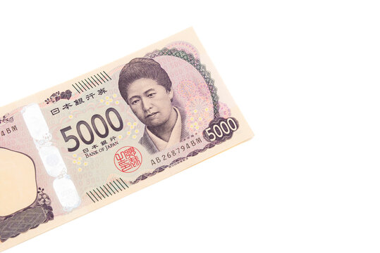 Top view of the front side of a 5,000 Japanese yen banknote featuring Higuchi Ichiyo. Currency isolated on white background. Finance, economy, and cash concepts.