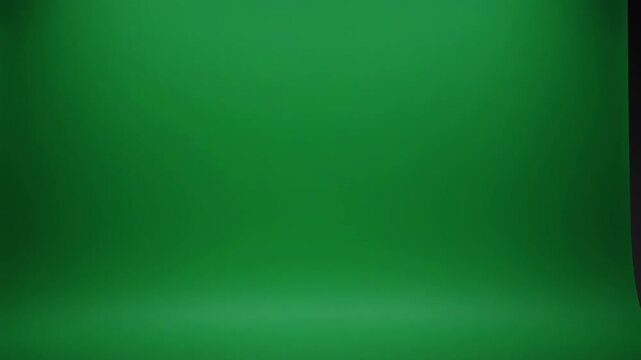 Empty studio with green cyclorama background and professional lighting setup for creative production