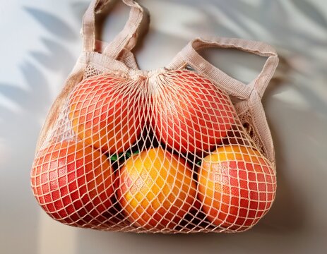grapefruit in a reusable mesh string bag for shopping fresh citrus fruit grocery