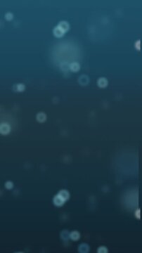 Blurred blue bokeh circles on dark background. 2d animation