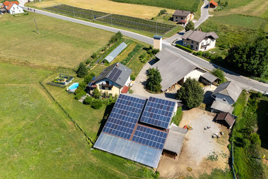 Aerial view of a modern private farm powered by solar energy panels