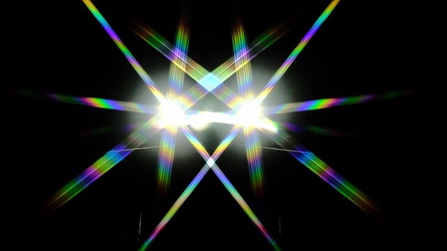 a bright starburst effect with colorful lens flares, often created by photographing a strong light source directly