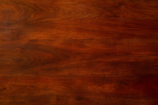 Top view of empty dark brown walnut mahogany wood grain texture background with vintage rustic pattern