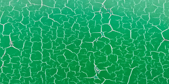 close up broken surface of deteriorating green tennis court floor. background and sports concept.