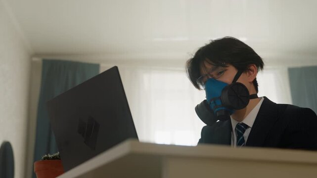 Analyst examines data. Individual studies sensitive information under faint lighting conditions. Expert investigates critical security details while working alone in low light environment