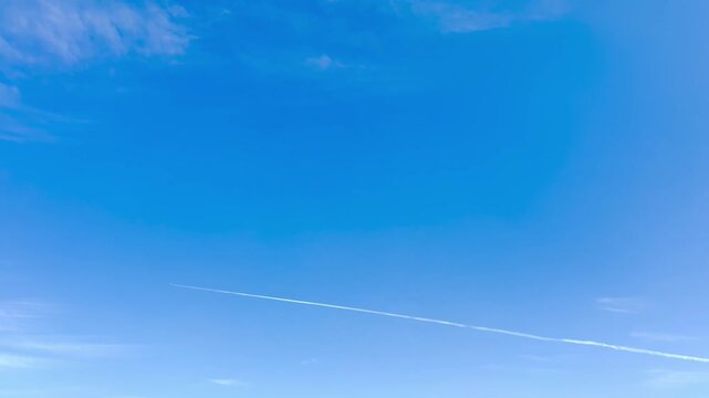 Airplane Vapor Trail Contrail Line Across Clear Blue Sky Sunny Day Wide Angle View Shot