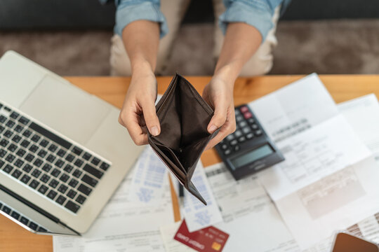 Bankruptcy problem financial concept, Young man opening empty wallet stress to find money to pay debt mortgage period