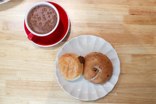 bread, bun or cranberry bread or cranberry bun or cranberry bagel and donut or doughnut with hot cocoa