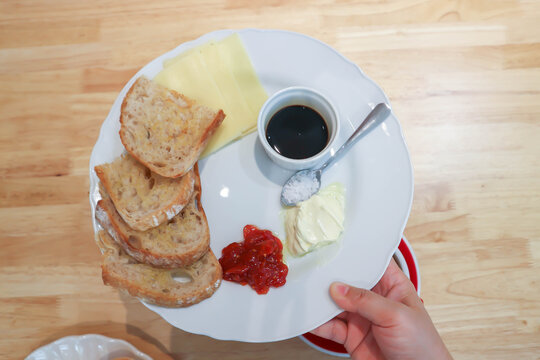 sourdough bread or bread or whole wheat bread or sliced bread with cranberry sauce ,honey and cheese
