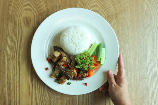 stir fried pork or deep fried pork , fried pork or crispy pork and rice or pork and rice