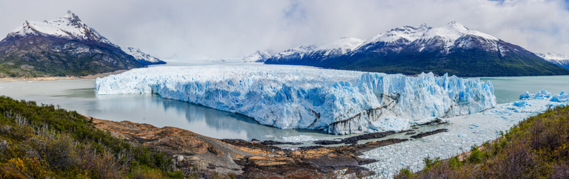 Panorama image of the famous glacier tongue Perito Moreno in the Andes mountains of Patagonia, Argentina