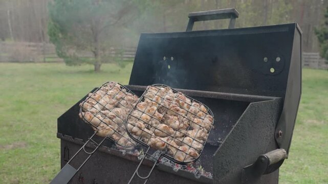 Fresh marinated meat grilling over hot charcoal and open flame