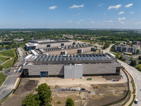 Aerial side view of NTT Global Data Center buildings and campus expansion construction
