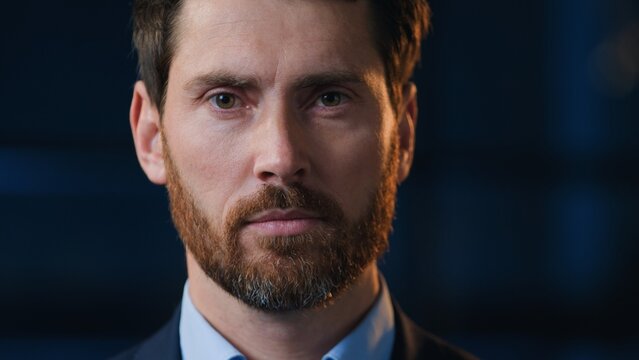 Close up business portrait serious confident Caucasian 40s man looking at camera in dark company adult male businessman look gaze staring in evening night office specialist professional executive