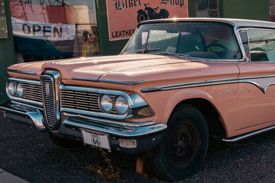 09 August 2026 - Seligman, Arizona, USA: Vintage peach 1950s Edsel Ranger parked outside a retro biker shop along Historic Route 66, Arizona, USA. Classic American automobile, chrome details