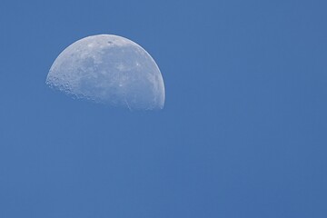 A crescent moon in the sky. © nopwaratch