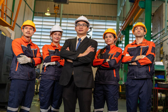 Engineer Factory, worker, team, helmet, uniform, safety, industry group in workshop with confident leader and industrial equipment