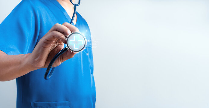 Healthcare professional holding digital stethoscope with glowing medical cross. Smart healthcare, telemedicine, medical technology, digital diagnosis, patient care, and modern hospital innovation.