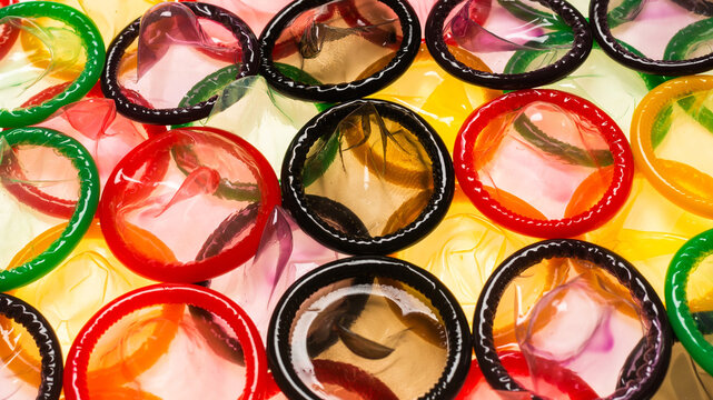 Colorful condoms background.