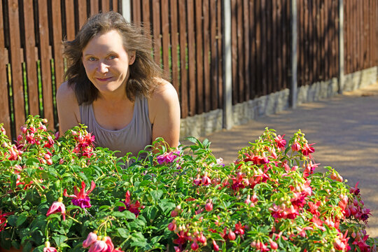 Portrait by the Fuchsia planter.