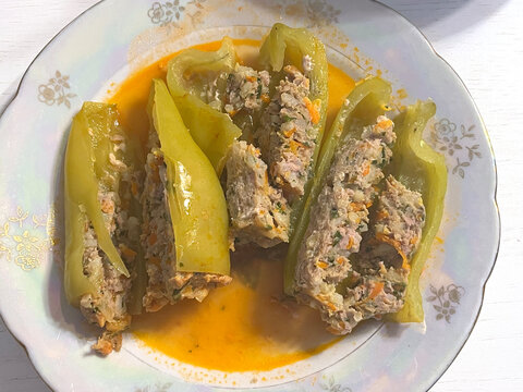 Stuffed green pepper with minced meat, home‑cooked food on a plate, top view