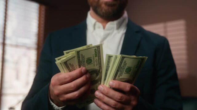 Unknown Caucasian bearded business man count cash currency exchange male hands holding dollars stack counting money businessman employer worker with financial salary savings credit deposit earnings
