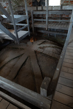 Abandoned stone well inside an old industrial building