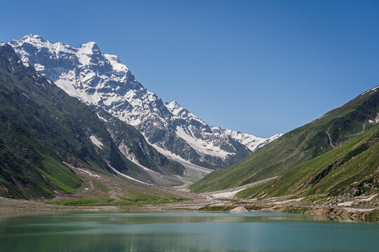 Scenic mountain landscape view of snowcapped Malika Parbat peak and colorful Saiful Muluk lake near Naran, Kaghan valley, Khyber Pakhtunkhwa, Pakistan