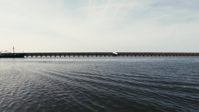 A peaceful view of calm water in a sheltered harbor inlet in Harlingen, Friesland, Netherlands.