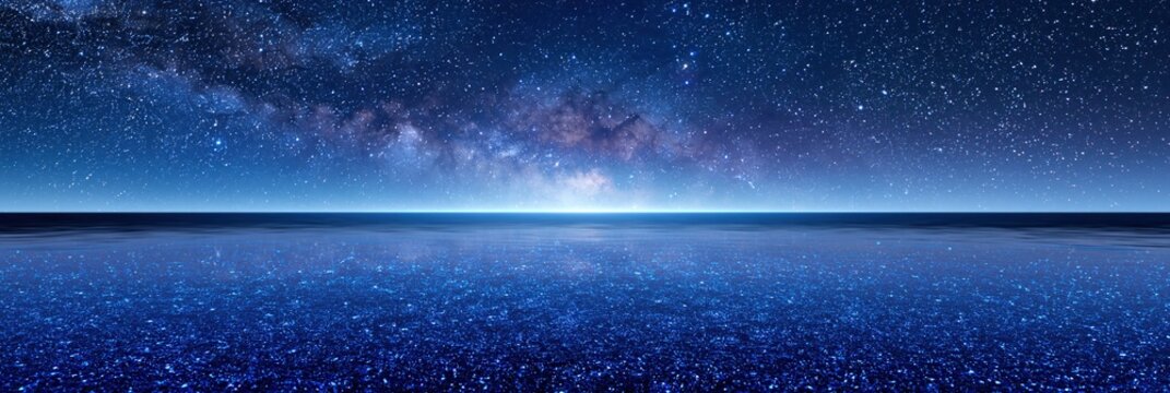 Vast Starry Night Sky Over Reflective Ocean Surface with Milky Way Galaxy