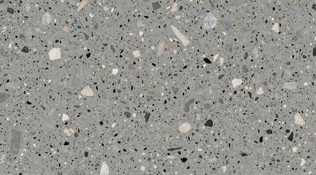 Close up of a grey terrazzo surface with visible aggregate fragments.