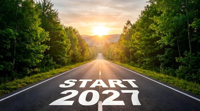 Road leading into the horizon with the words start 2027 painted on the asphalt at sunrise