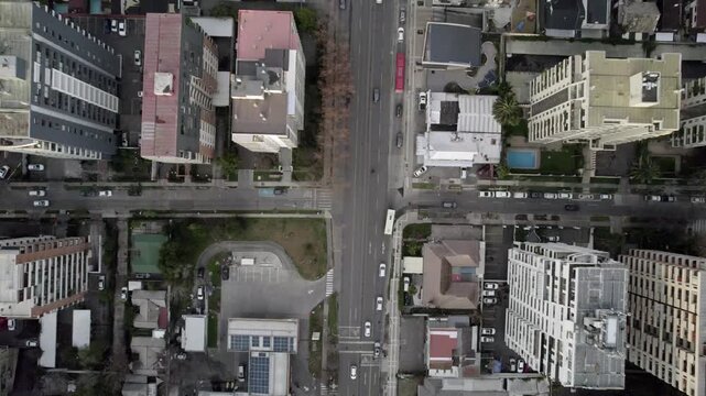 Overhead Drone View Tracking A Road Ending At Traffic Circle In Santiago Chile