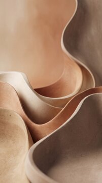 Abstract composition of layered organic shapes in soft neutral beige and brown tones.