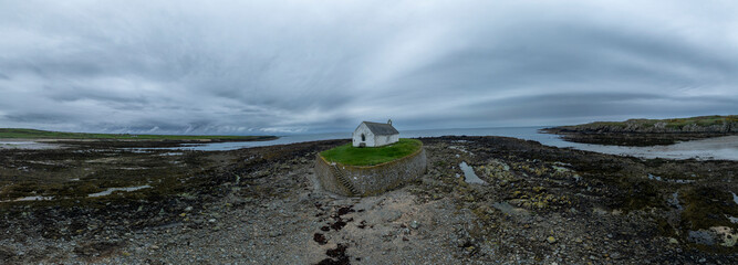 Aerial panorama of the Church in the Sea - St Cwyfan's church (Eglwys Cwyfan), Anglesey, Wales © Julian Gazzard