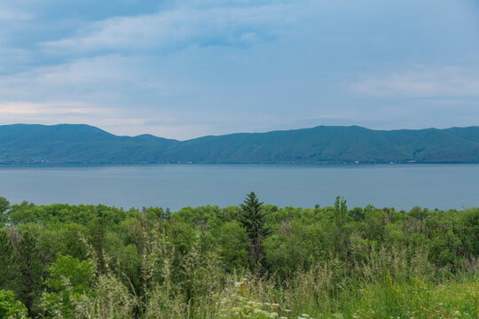 Scenic Lake Sevan landscape in Armenia with mountains forest and sky copy space