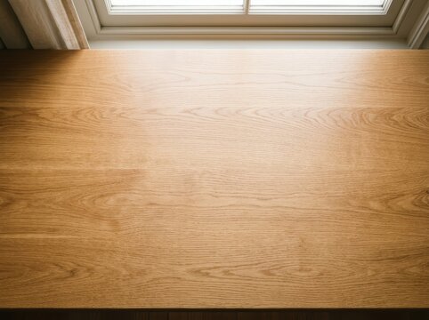 Empty Wooden Desk With Natural Light From Overhead, Offering A Clean And Minimalist Workspace.