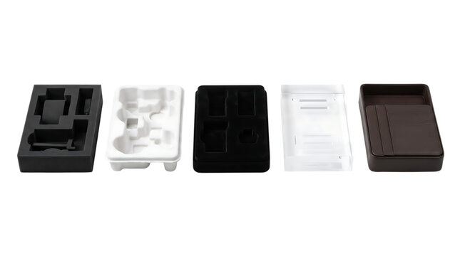 Set of various industrial plastic and foam packaging inserts for electronic products on white background