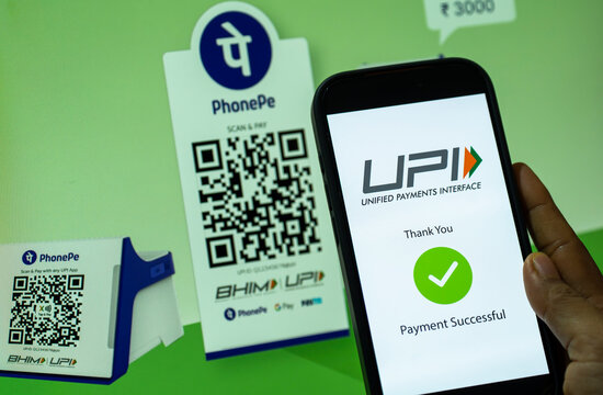 In this photo illustration, A smartphone displays a successful UPI payment beside PhonePe QR codes, in New Delhi, India on 9 August 2026.