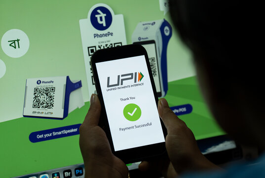 In this photo illustration, A smartphone displays a successful UPI payment beside PhonePe QR codes, in New Delhi, India on 9 August 2026.