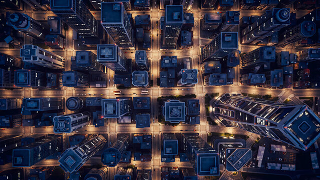 Aerial view of a gridded city street network illuminated at night with top-down