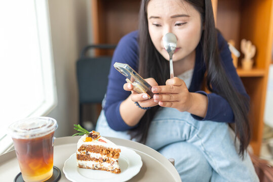 Young Woman Using Nose Strip While Drinking Tea and Eating Cake