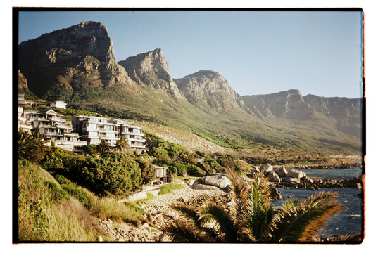 Photo of the mountainside from a rocky beach