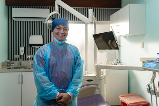 Dental healthcare provider smiling in modern clinic setting