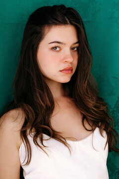 Siena agudong portrait standing against green background