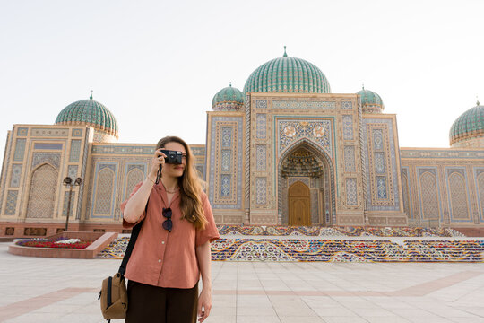 Tourist With Film Camera At Khujand Fortress in Tajikistan 